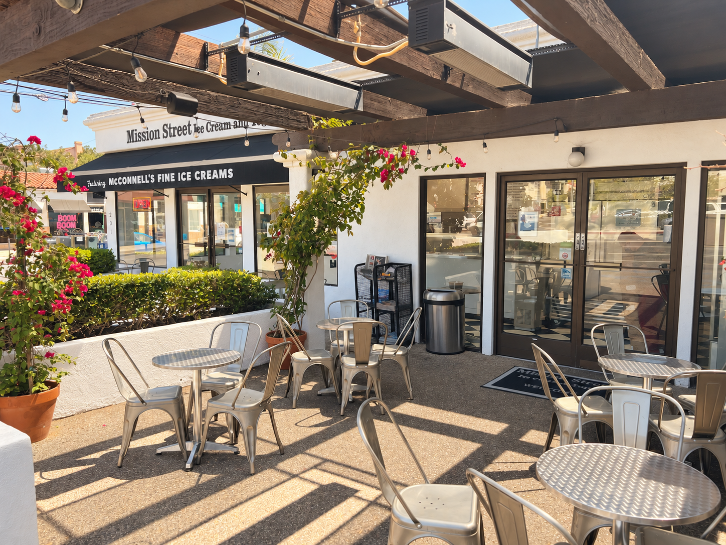 Outdoor patio seating beneath string lights at Mission Street Ice Cream and Yogurt